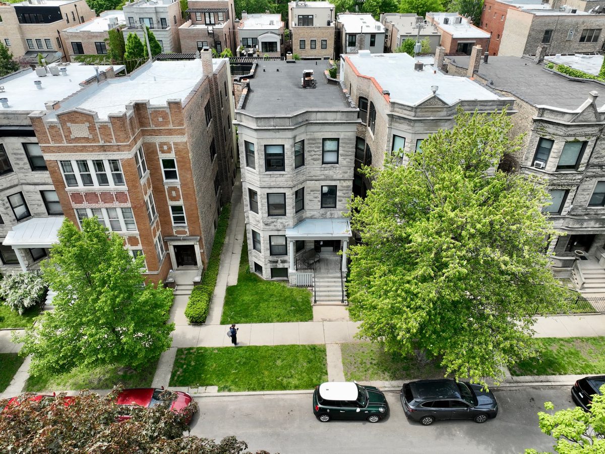 Aerial view of a block of Chicago greystones from the street side