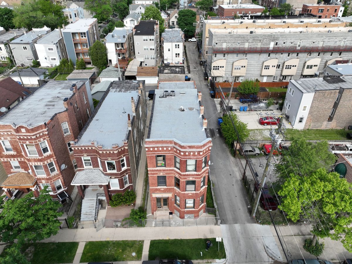 Aerial view of a Chicago brick three-flat, roof, parapet and rear elevation